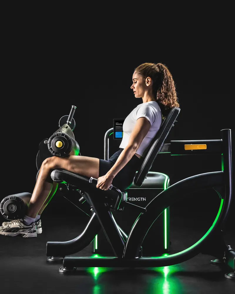 Athlete using the iStrength Leg Extension/Curl