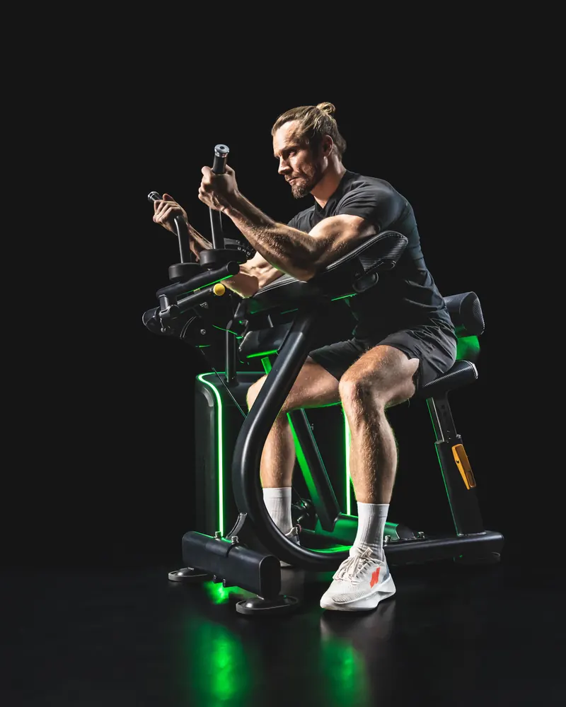 Athlete performing a curl on the iStrength Biceps/Triceps